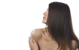 Body Care. Woman Applying Moisturizing Lotion Or Cream on her body photo