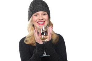 Beautiful model portrait isolated over studio background hold wine glass. photo