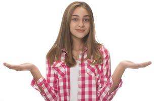 young beautiful woman in gray shirt , holding imaginary object on the palm. isolated on white photo