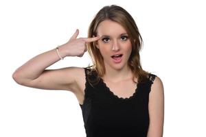 Close up studio portrait of cheerful blonde hipster girl going crazy making funny face photo