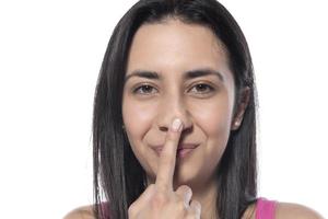 A woman who pinches the fat on her jaw. photo