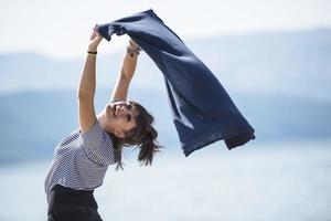 happy woman by a lake photo