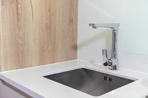 stainless steel kitchen sink in room photo