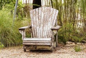 Outdoor wooden chair in garden photo