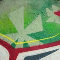 Street art. Abstract background image of a fragment of a colored graffiti painting in chrome and red tones photo