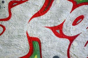 Street art. Abstract background image of a fragment of a colored graffiti painting in chrome and red tones photo