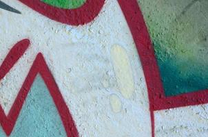 Street art. Abstract background image of a fragment of a colored graffiti painting in chrome and red tones photo