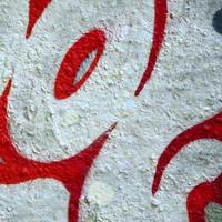 Street art. Abstract background image of a fragment of a colored graffiti painting in chrome and red tones photo