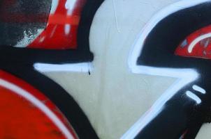 Street art. Abstract background image of a fragment of a colored graffiti painting in chrome and red tones photo