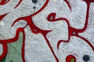 Street art. Abstract background image of a fragment of a colored graffiti painting in chrome and red tones photo