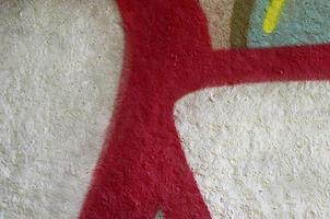 Street art. Abstract background image of a fragment of a colored graffiti painting in chrome and red tones photo
