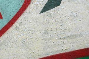 Street art. Abstract background image of a fragment of a colored graffiti painting in chrome and red tones photo
