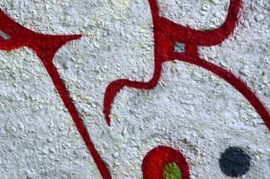 Street art. Abstract background image of a fragment of a colored graffiti painting in chrome and red tones photo