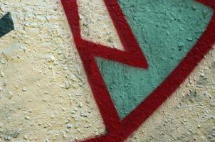 Street art. Abstract background image of a fragment of a colored graffiti painting in chrome and red tones photo