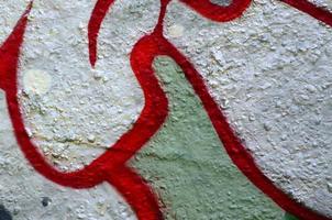 Street art. Abstract background image of a fragment of a colored graffiti painting in chrome and red tones photo