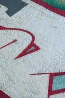 Street art. Abstract background image of a fragment of a colored graffiti painting in chrome and red tones photo