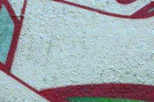 Street art. Abstract background image of a fragment of a colored graffiti painting in chrome and red tones photo