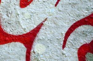 Street art. Abstract background image of a fragment of a colored graffiti painting in chrome and red tones photo