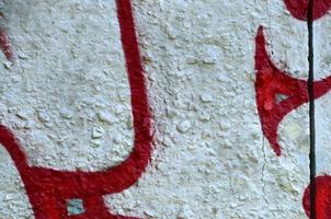 Street art. Abstract background image of a fragment of a colored graffiti painting in chrome and red tones photo