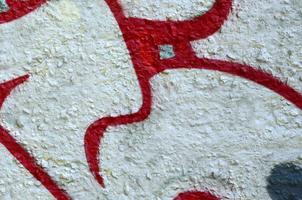 Street art. Abstract background image of a fragment of a colored graffiti painting in chrome and red tones photo