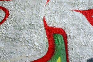 Street art. Abstract background image of a fragment of a colored graffiti painting in chrome and red tones photo