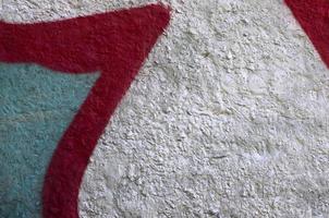 Street art. Abstract background image of a fragment of a colored graffiti painting in chrome and red tones photo