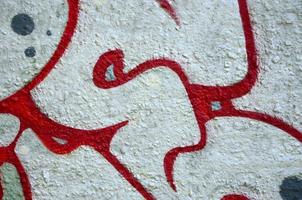 Street art. Abstract background image of a fragment of a colored graffiti painting in chrome and red tones photo