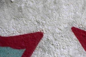 Street art. Abstract background image of a fragment of a colored graffiti painting in chrome and red tones photo