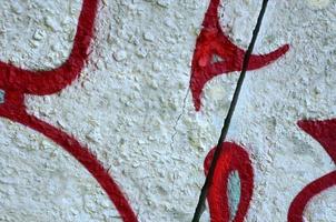Street art. Abstract background image of a fragment of a colored graffiti painting in chrome and red tones photo