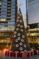 christmas tree tall buildings in the background, christmas and business concept, mexico photo