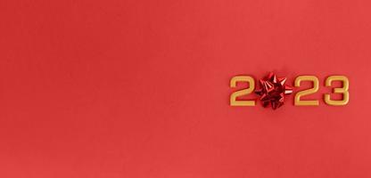 Numbers 2023 on a red background. New Year and Christmas concept. Banner, copy space photo