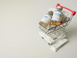 The vaccine covid 19 in supermarket cart for medical or sci concept photo