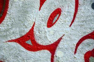 Street art. Abstract background image of a fragment of a colored graffiti painting in chrome and red tones photo