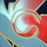 arte callejero. imagen de fondo abstracta de un fragmento de una pintura de graffiti coloreada en tonos rojos foto