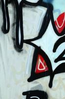 Street art. Abstract background image of a fragment of a colored graffiti painting in chrome and red tones photo