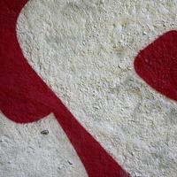 Street art. Abstract background image of a fragment of a colored graffiti painting in chrome and red tones photo