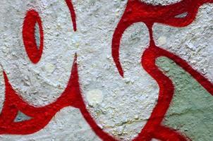 Street art. Abstract background image of a fragment of a colored graffiti painting in chrome and red tones photo