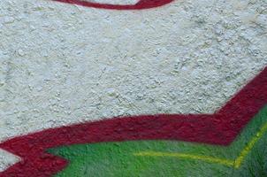 Street art. Abstract background image of a fragment of a colored graffiti painting in chrome and red tones photo