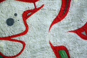 Street art. Abstract background image of a fragment of a colored graffiti painting in chrome and red tones photo