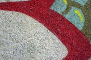 Street art. Abstract background image of a fragment of a colored graffiti painting in chrome and red tones photo