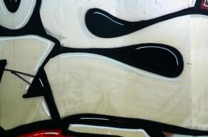 Street art. Abstract background image of a fragment of a colored graffiti painting in chrome and red tones photo