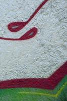 Street art. Abstract background image of a fragment of a colored graffiti painting in chrome and red tones photo