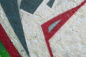 Street art. Abstract background image of a fragment of a colored graffiti painting in chrome and red tones photo