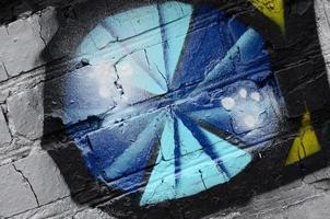 Street art. Abstract background image of a fragment of a colored graffiti painting in chrome and blue tones photo