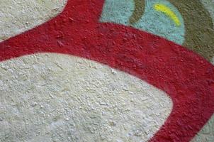 Street art. Abstract background image of a fragment of a colored graffiti painting in chrome and red tones photo