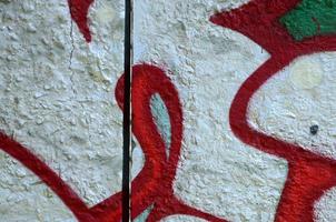 Street art. Abstract background image of a fragment of a colored graffiti painting in chrome and red tones photo