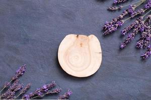 Podium, stage or pedestal with lavender flowers top view. Mock up for cosmetic products photo