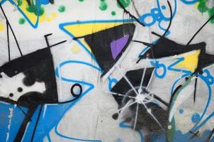 Street art. Abstract background image of a fragment of a colored graffiti painting in chrome and blue tones photo