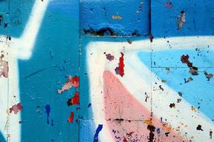 Street art. Abstract background image of a fragment of a colored graffiti painting in blue tones photo