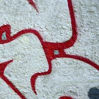 Street art. Abstract background image of a fragment of a colored graffiti painting in chrome and red tones photo